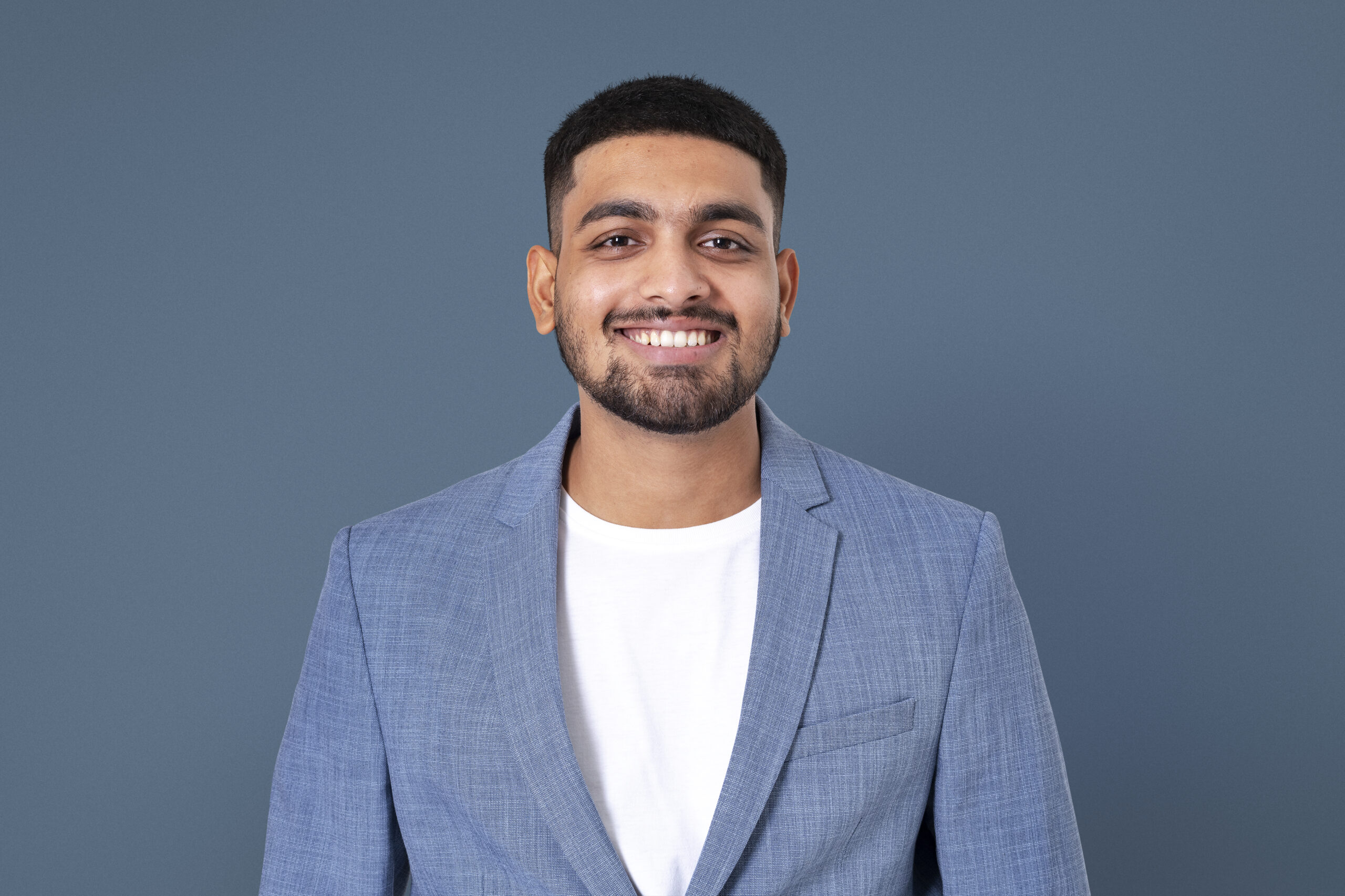 Cheerful Indian businessman smiling closeup portrait for jobs an